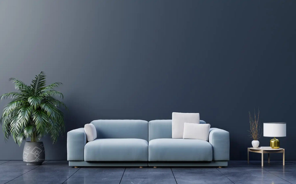 Sofa màu xanh nhạt hiện đại với đường nét sạch sẽ và gối ném trắng.