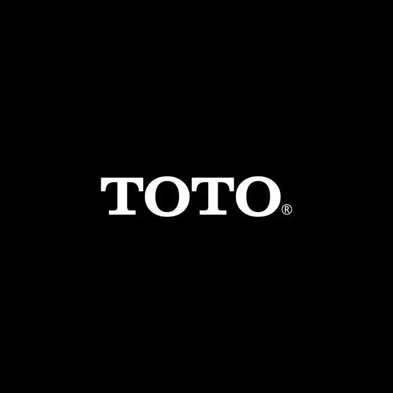 Logo TOTO màu trắng trên nền đen.